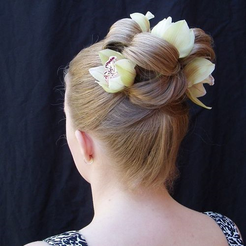sleek updo with flowers