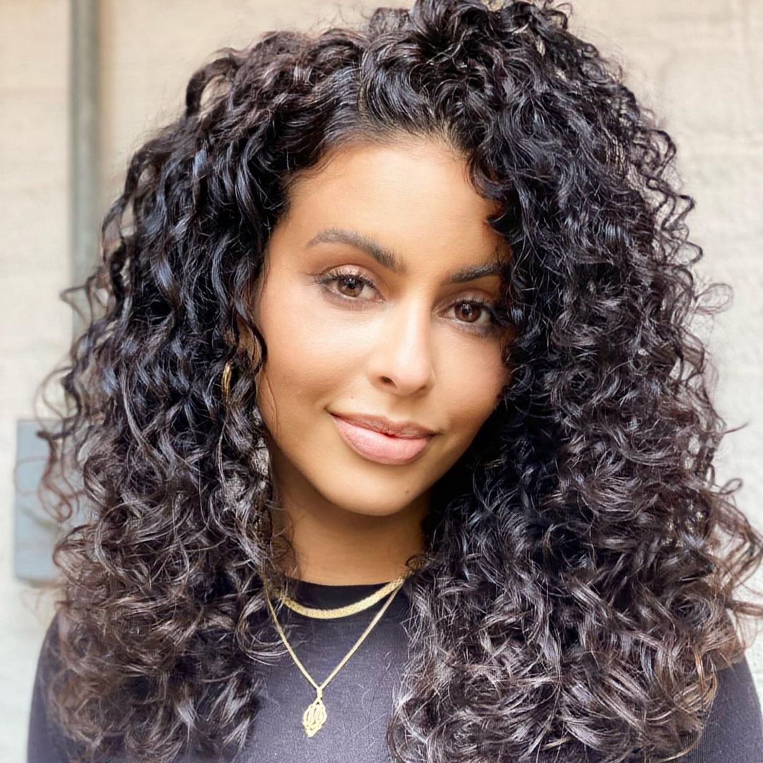 Bouncy long layered curly hair