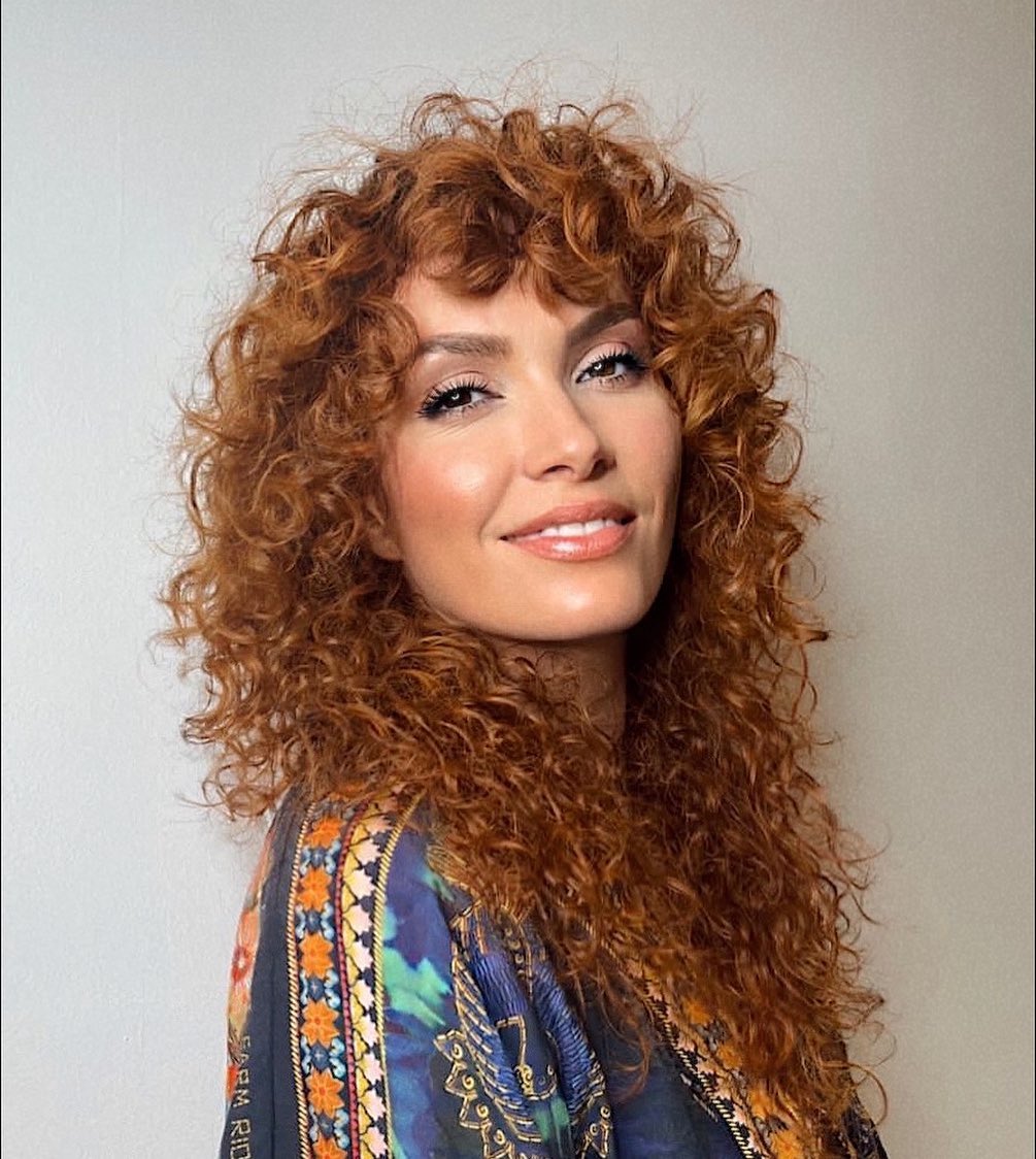 Long red curly shag haircut