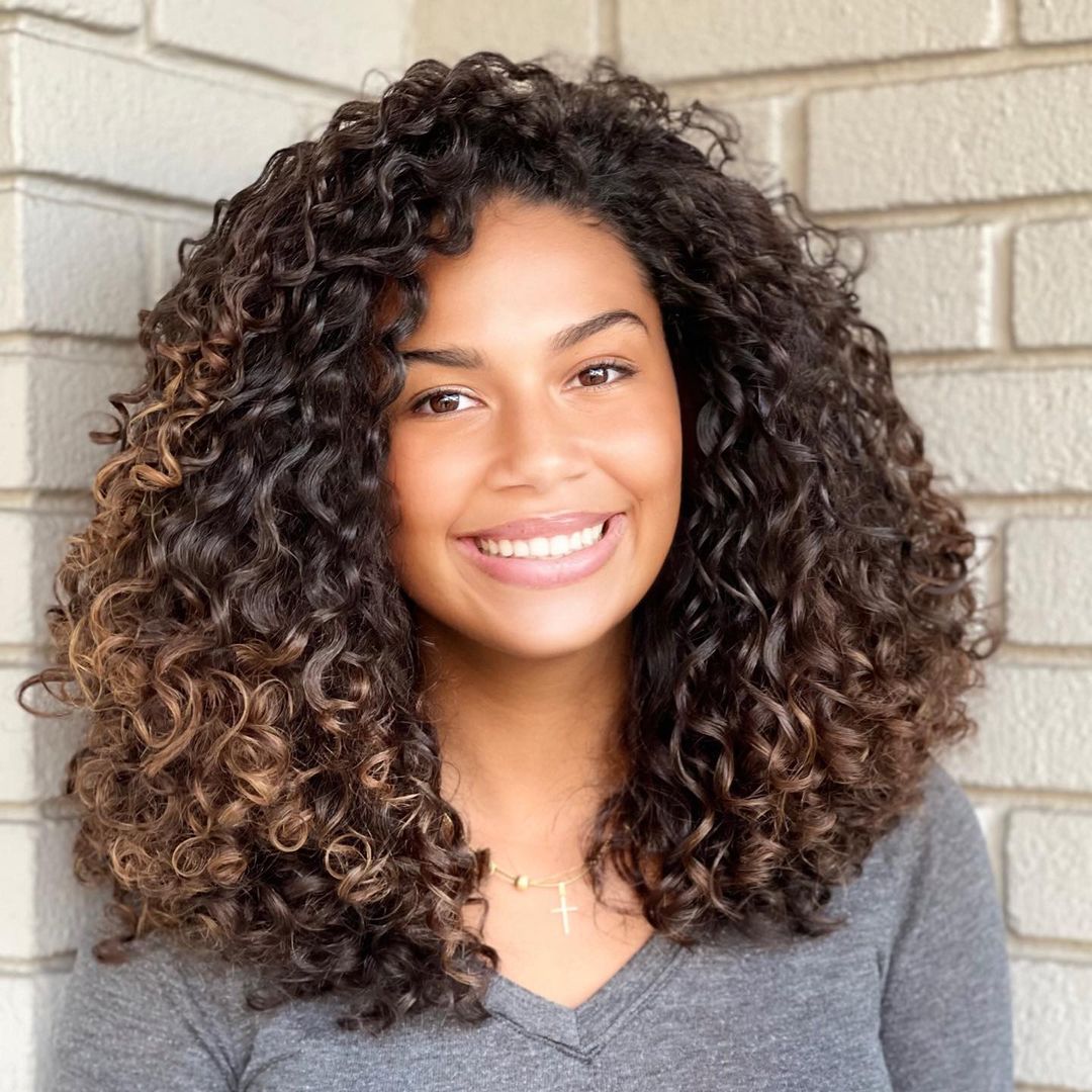 Brunette curly hair with blonde highlights