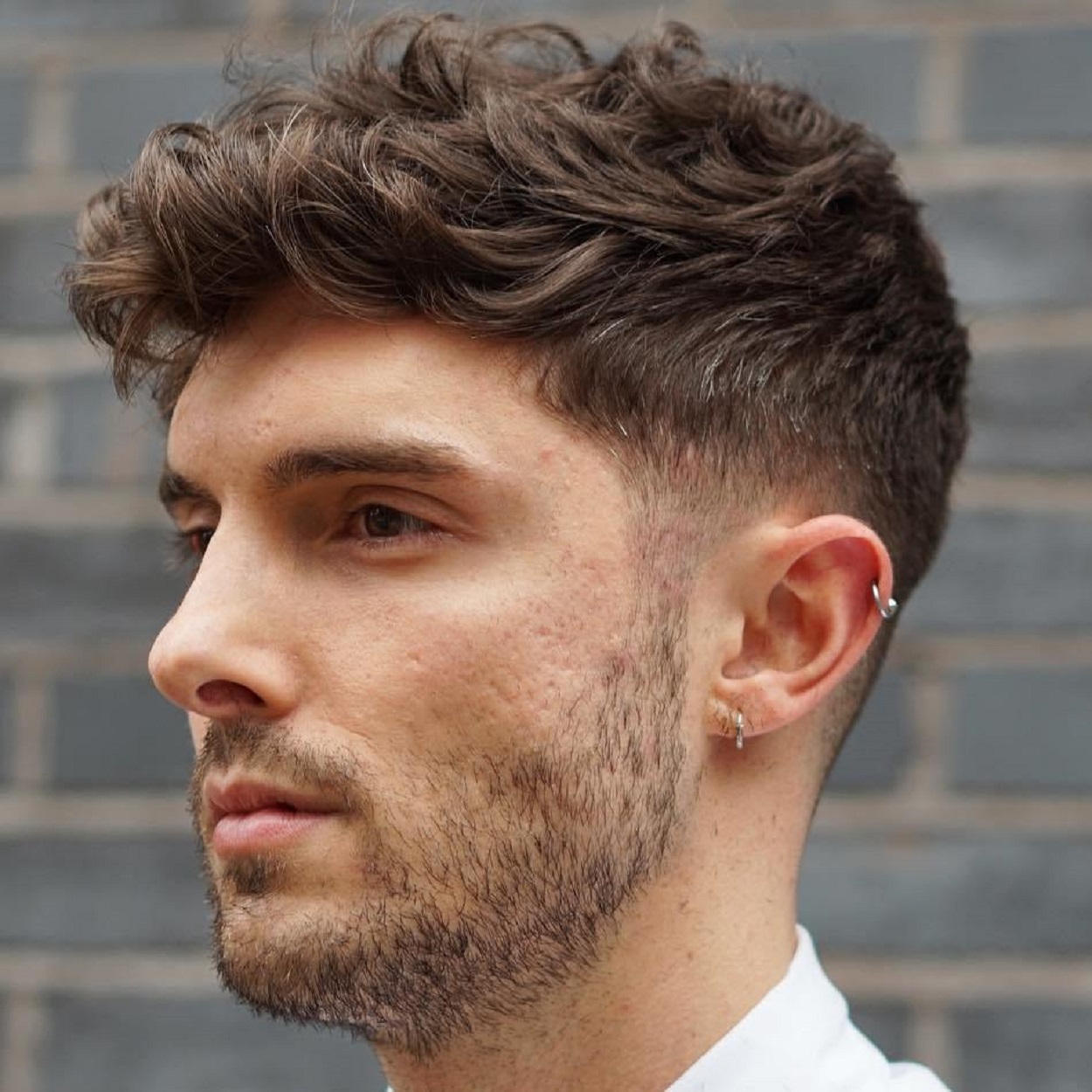 Quiff with a center part-40+ Modern Hairstyles for Men with Wavy Hair in 2023