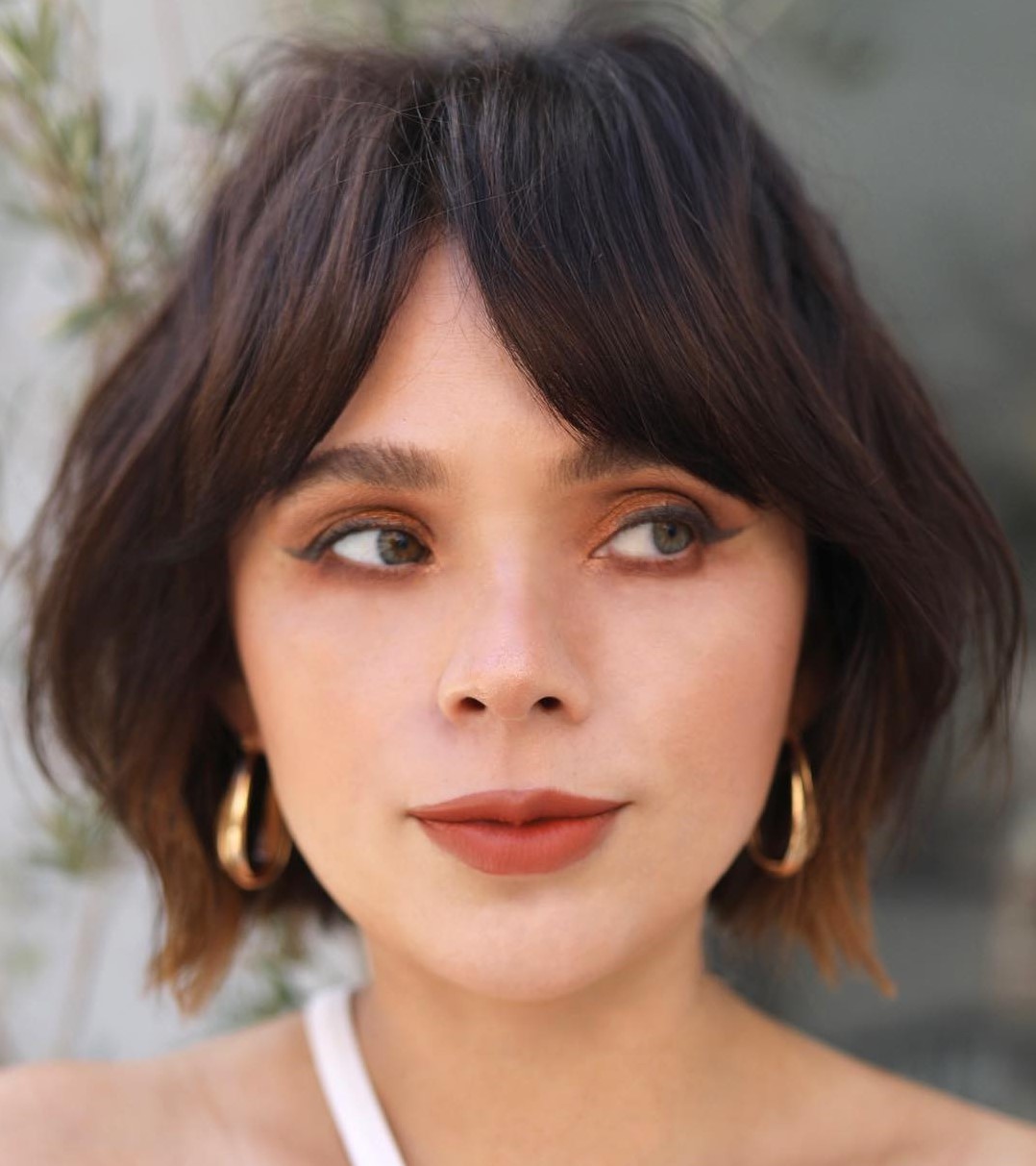 French bob at chin length with curtain bangs