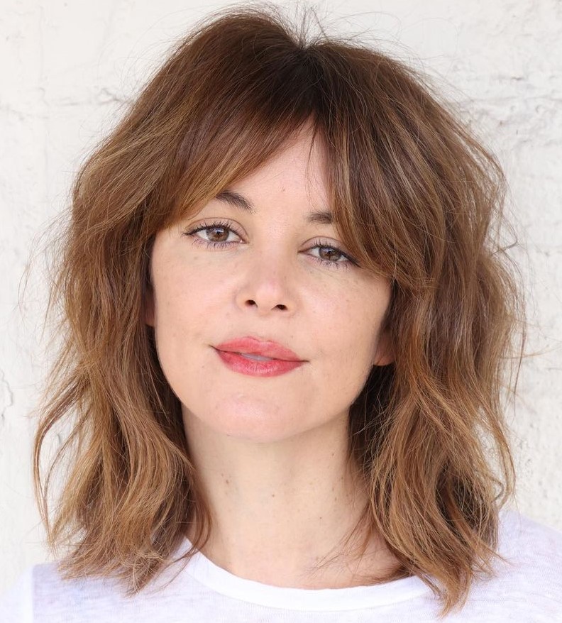 Soft wavy bob with a centre parting and curtain bangs