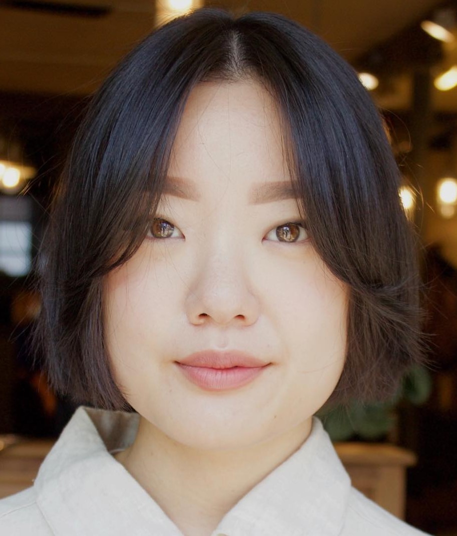 Ear-length cut with soft curtain bangs for fine hair