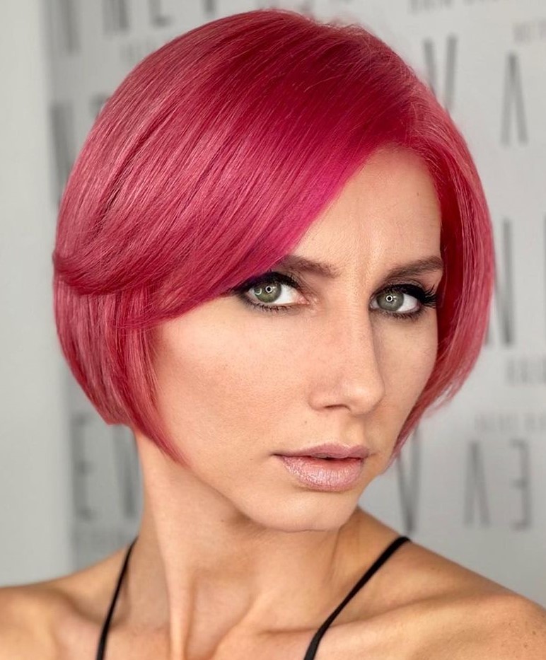 Magenta pixie bob with side-swept curtain bangs