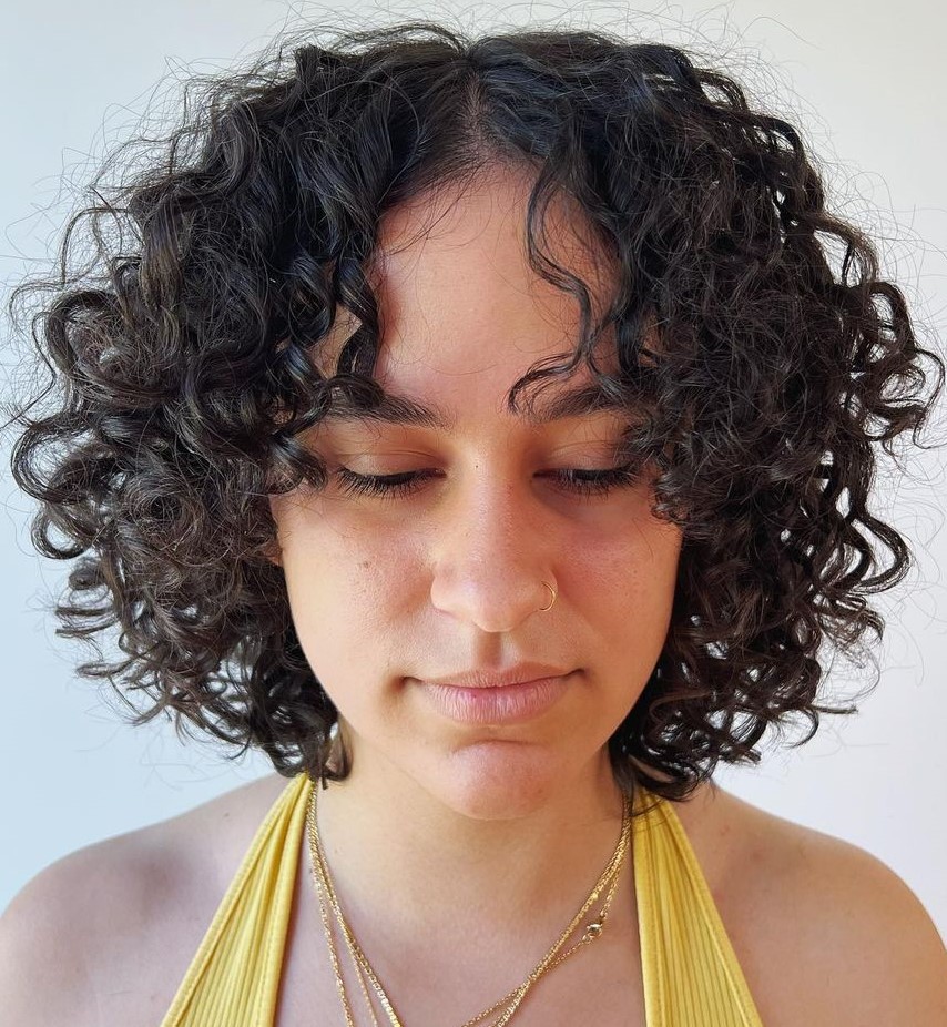 Layered curly bob with a soft curtain fringe