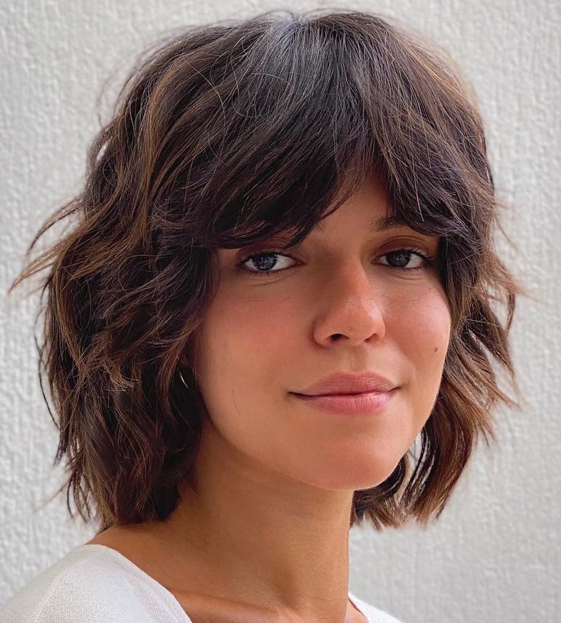 Short shag cut with thick curtain bangs