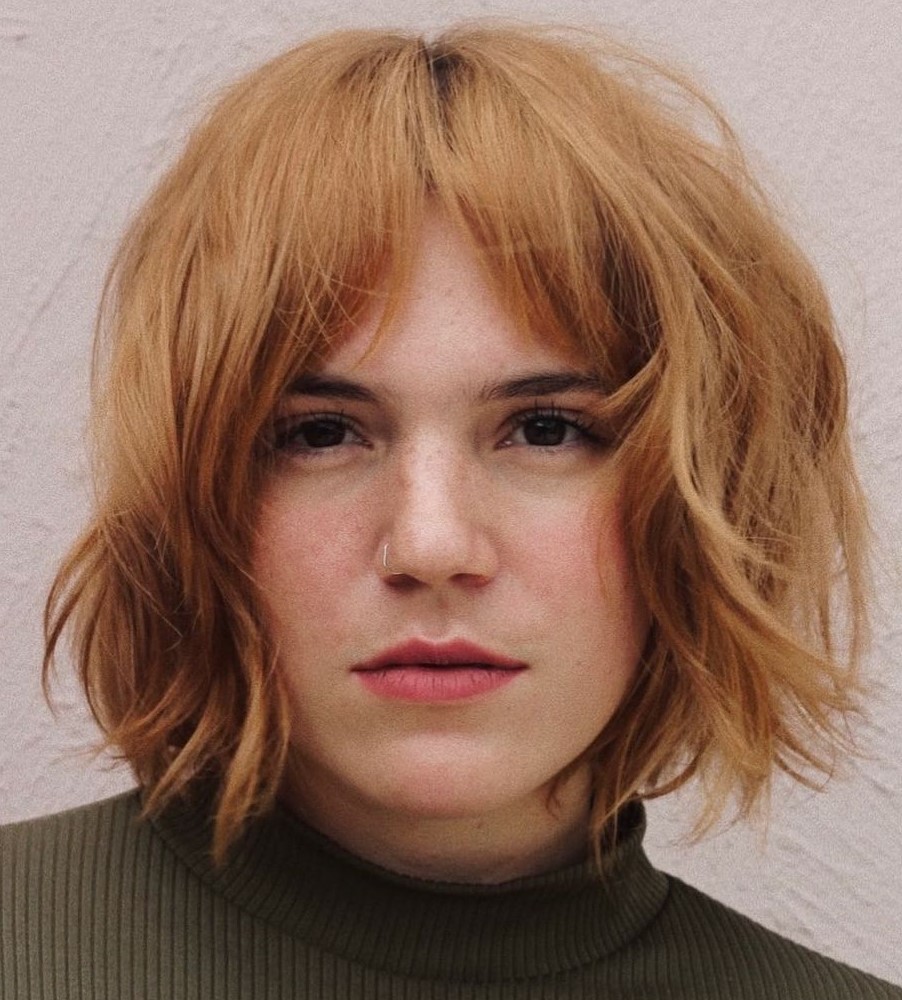 Messy bob with bottleneck curtain bangs