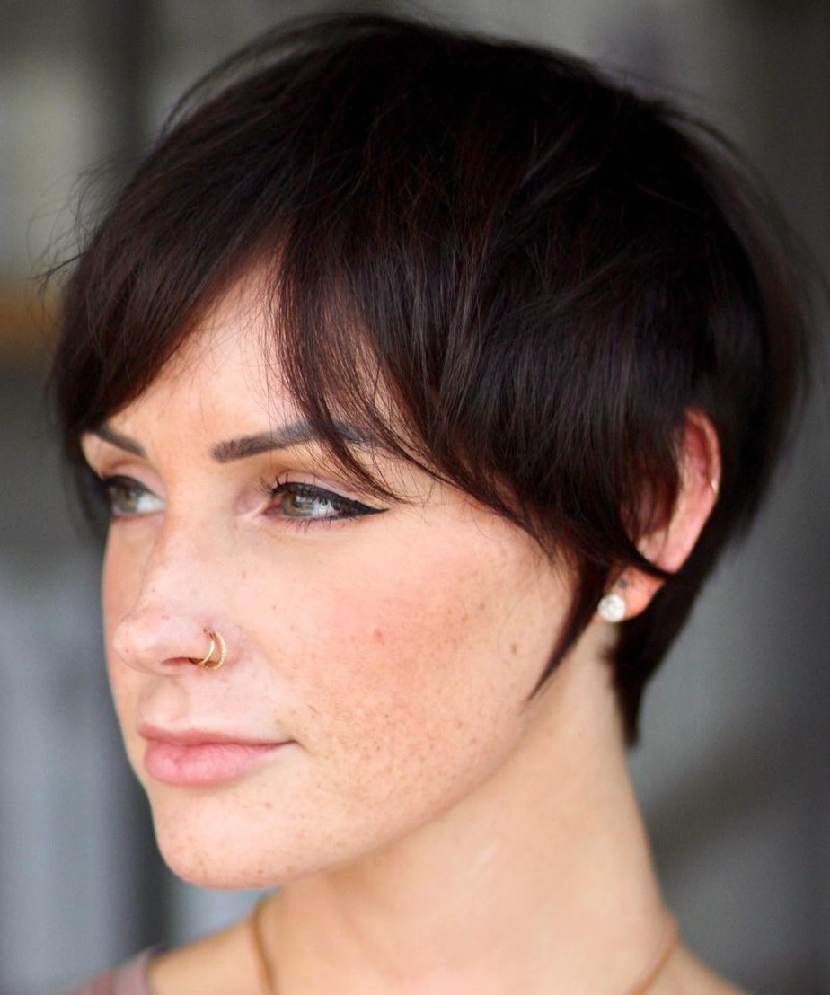 Pixie cut with a longer sweeping curtain fringe