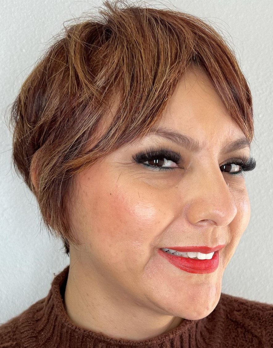 Bixie haircut with long parted curtain bangs