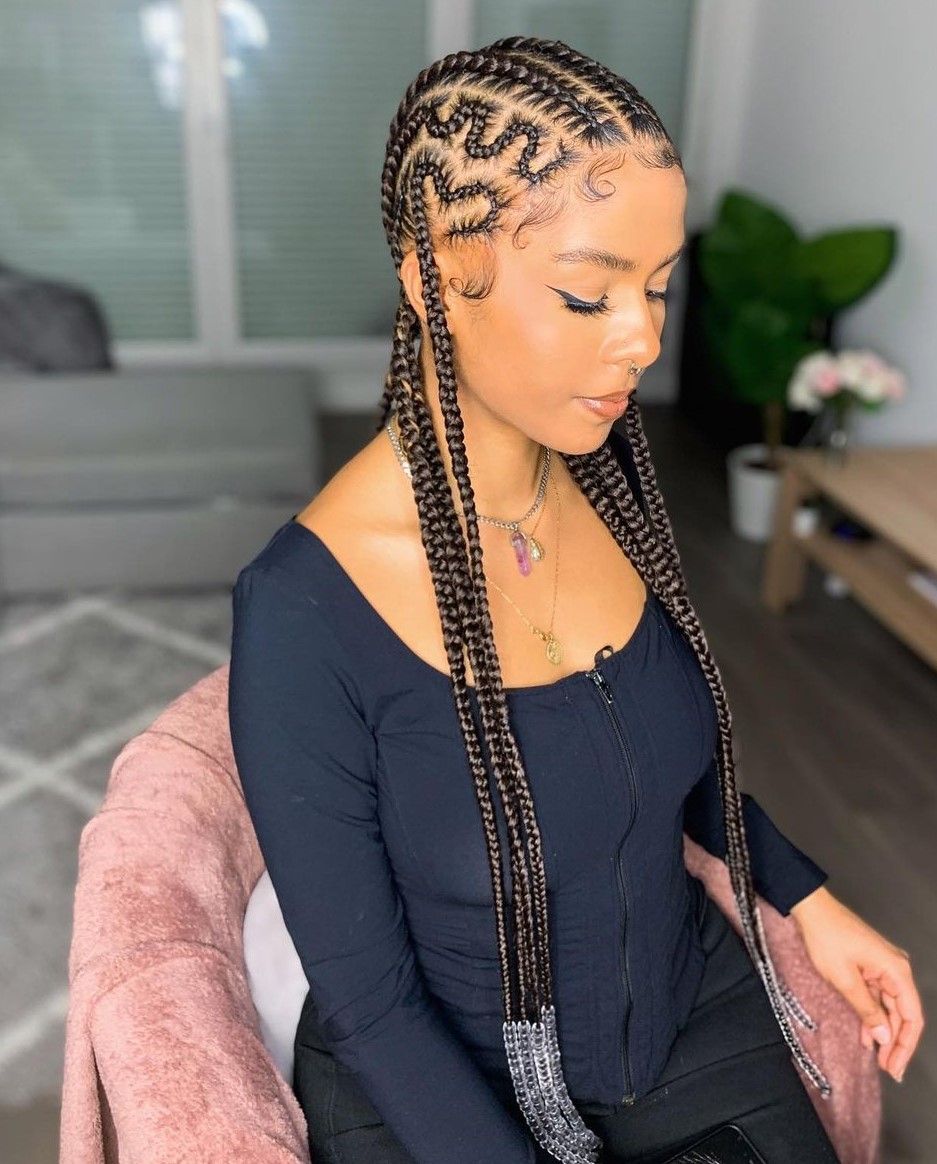 Long thin braids to the back with beads and styled baby hair