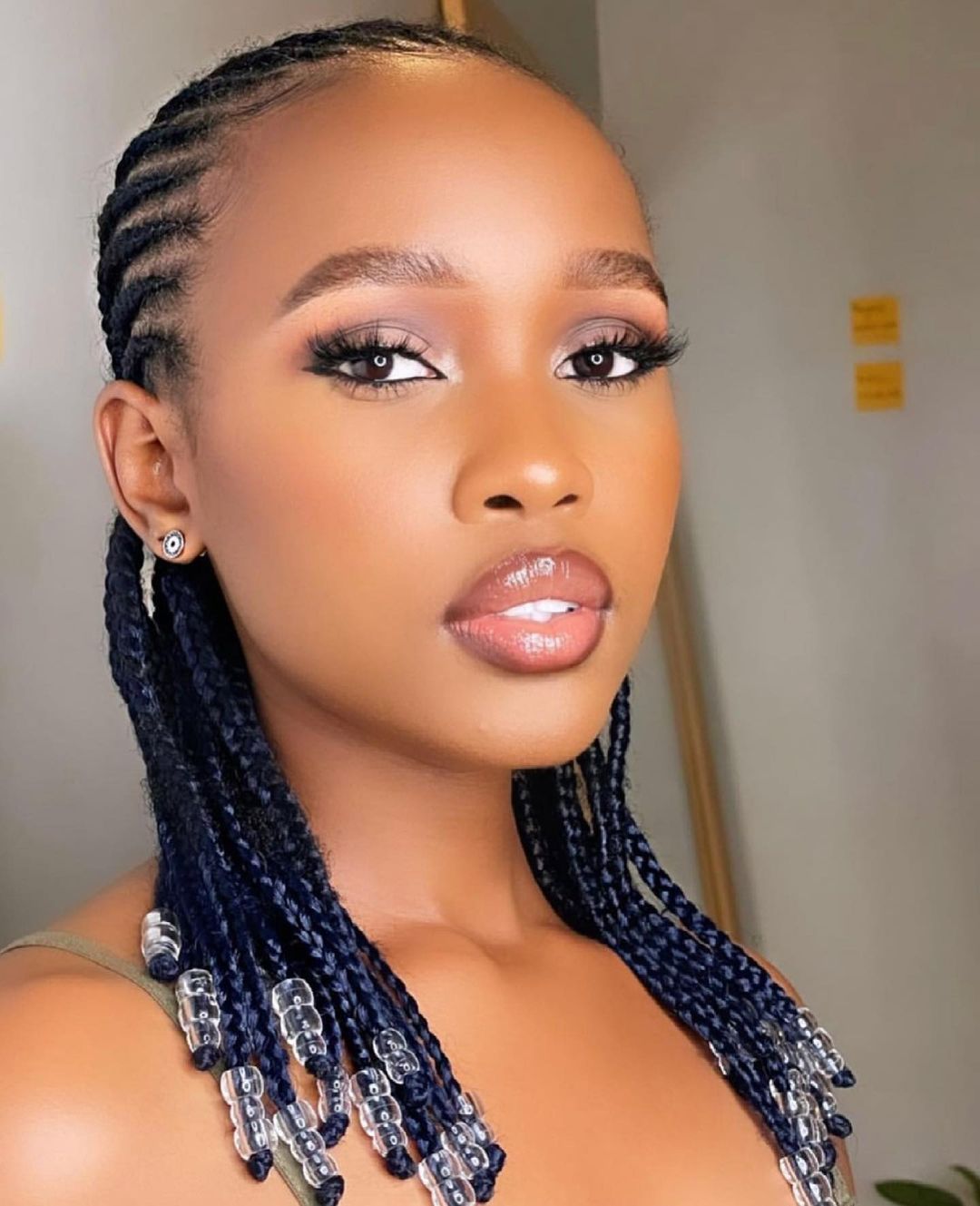 Short straight-back cornrows decorated with clear beads