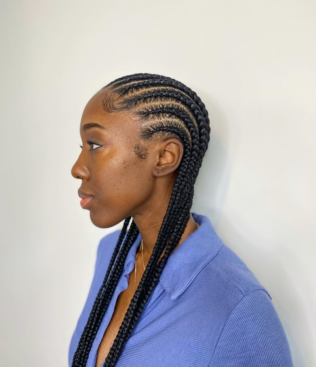 Evenly spaced tapered straight-back cornrows
