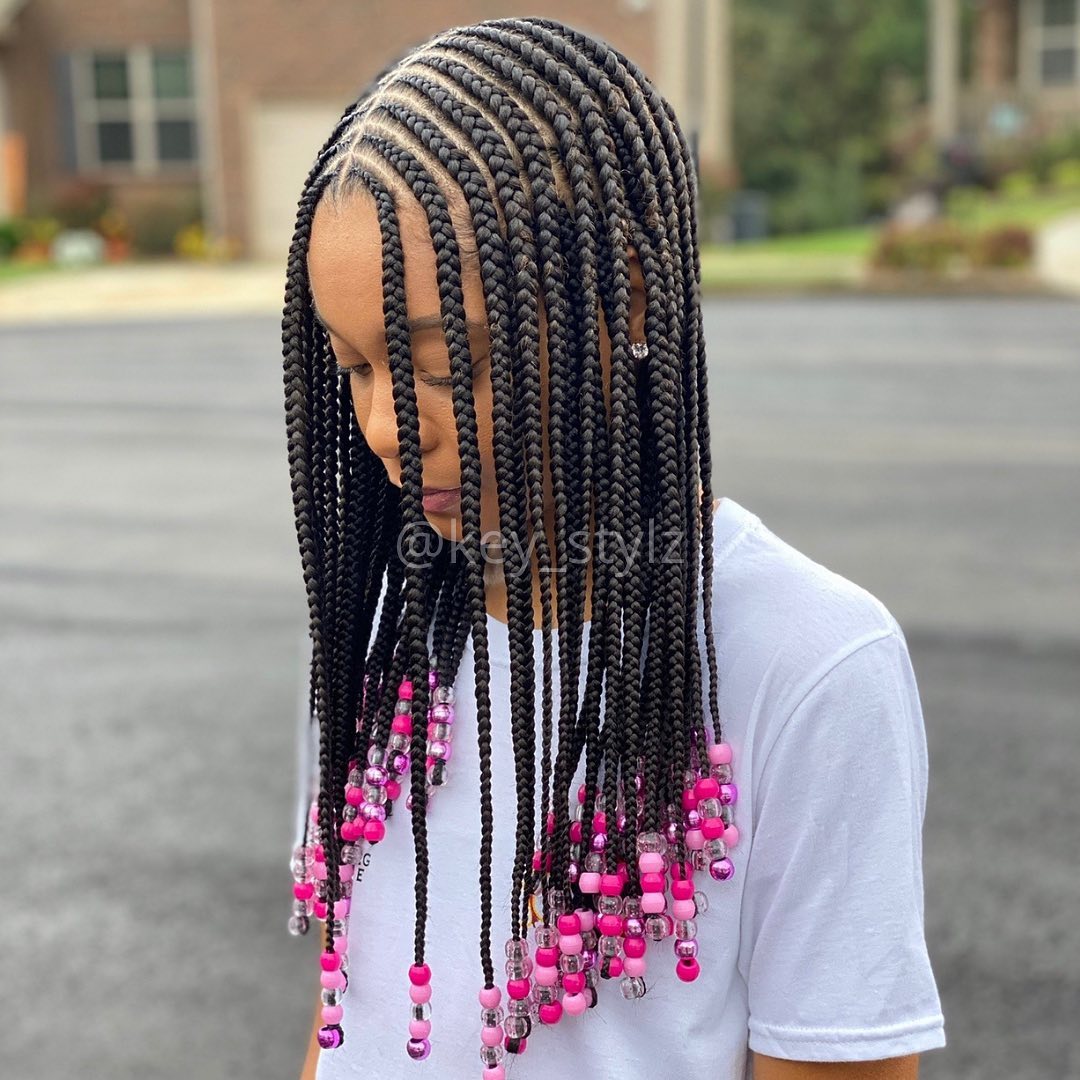 Centre-parted cornrows to the back with bead decoration