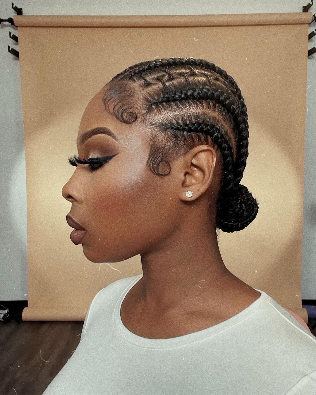 Sleek cornrows to the back with zigzag detailing and styled baby hair