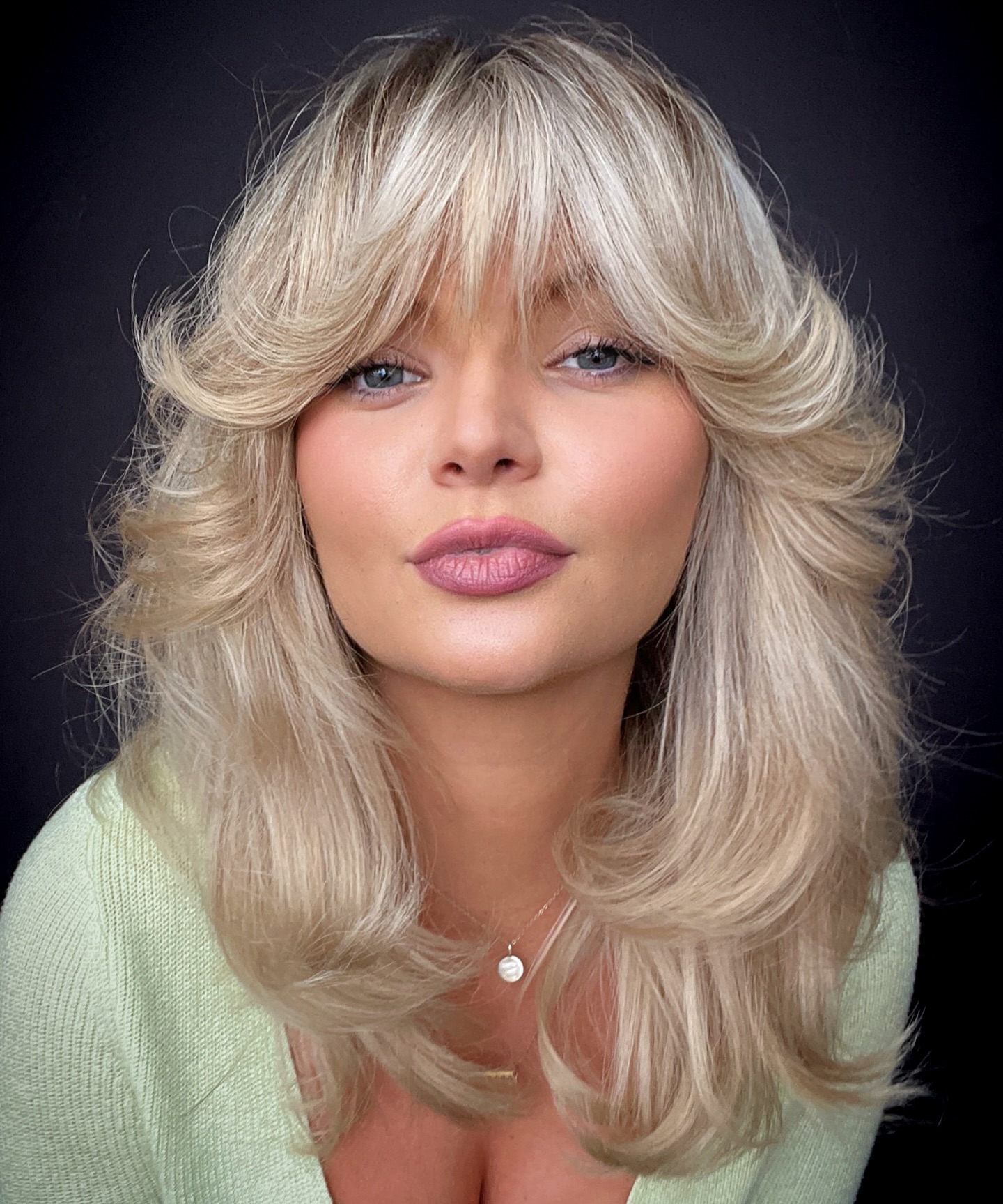 Long Blonde Feathered Hair