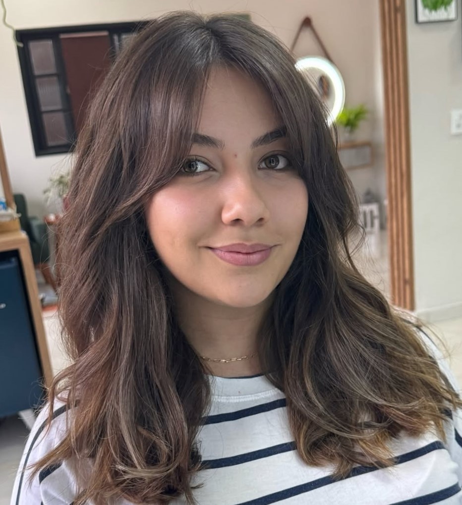 Oval Face Curtain Bang Hairstyle
