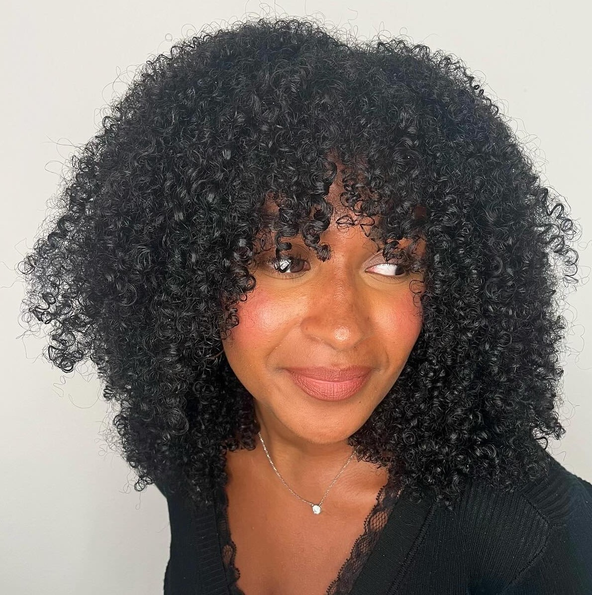 Medium Natural Hairstyle with Bangs